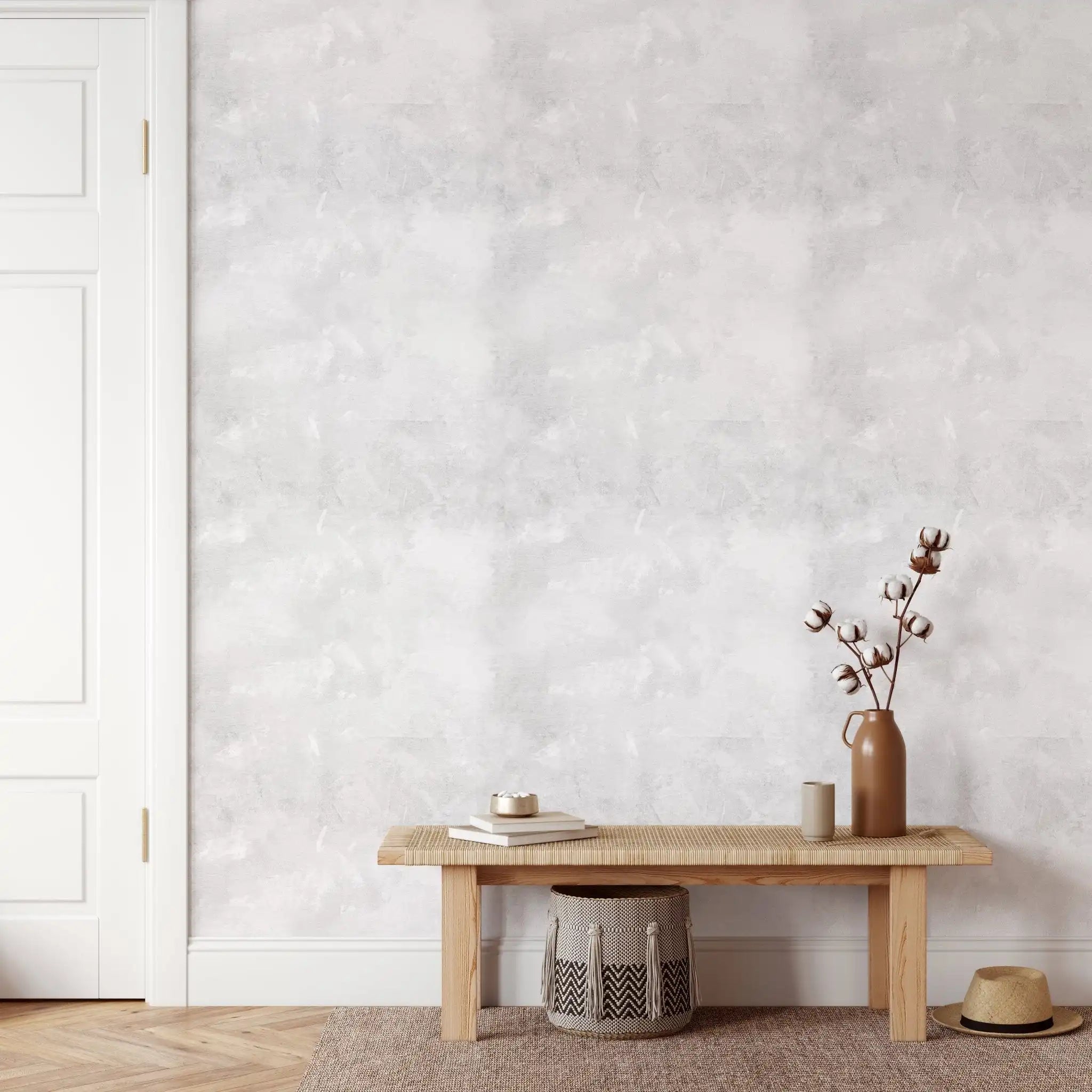 White limewash wallpaper styled with neutral bench and cotton stems in a modern farmhouse hallway