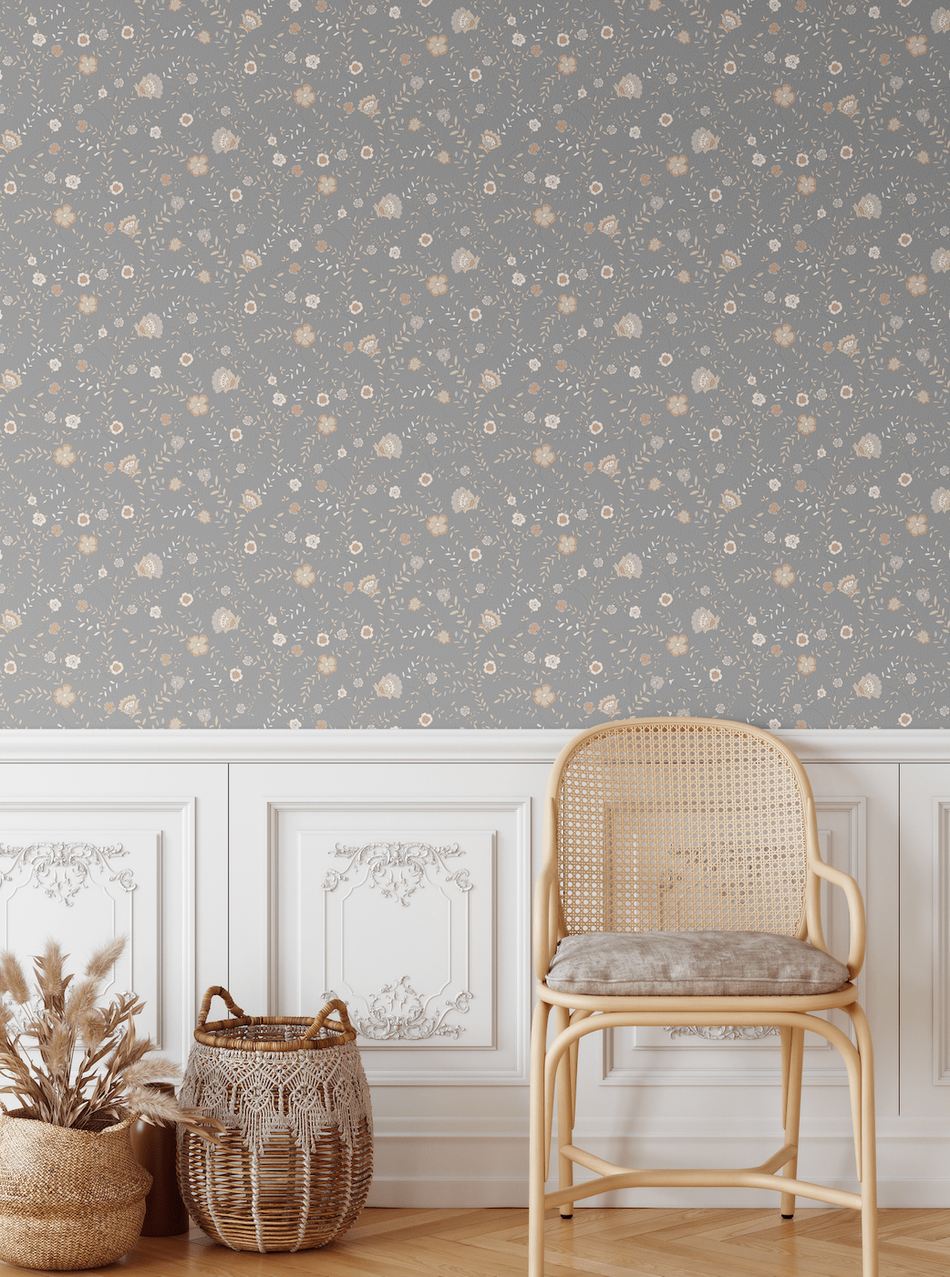 Elegant room featuring our Winter floral peel and stick wallpaper, paired with a traditional white wainscoting and a natural-toned wicker chair, creating a warm and inviting atmosphere with subtle floral patterns on a grey background
