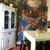 Aloha Dreams removable wallpaper tropical pattern floral wallpaper for the home in a kitchen with a white table and cabinet