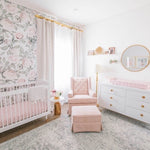 nursery wallpaper for walls in baby nursery with white crib and pink rocking chair with white cabinet