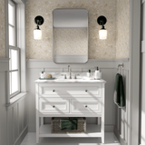 A clean and elegant bathroom with neutral birds and blossoms wallpaper, white vanity, and grey accents