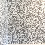 Grey and White peel and stick wallpaper over wainscotting