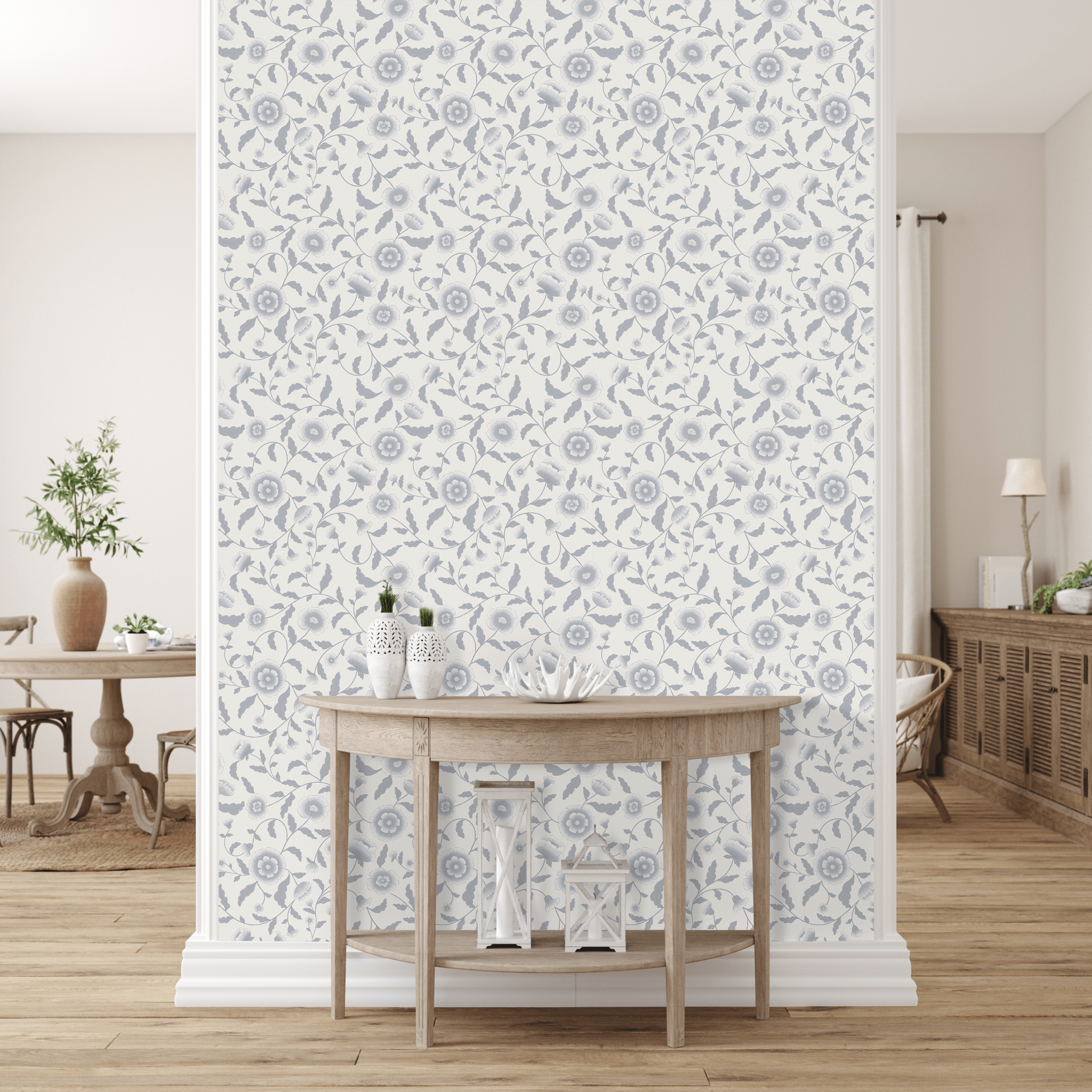 A room with blue floral peel-and-stick wallpaper, rustic table with vases, and ornaments. A plant, airy dining area, and wooden sideboard are visible