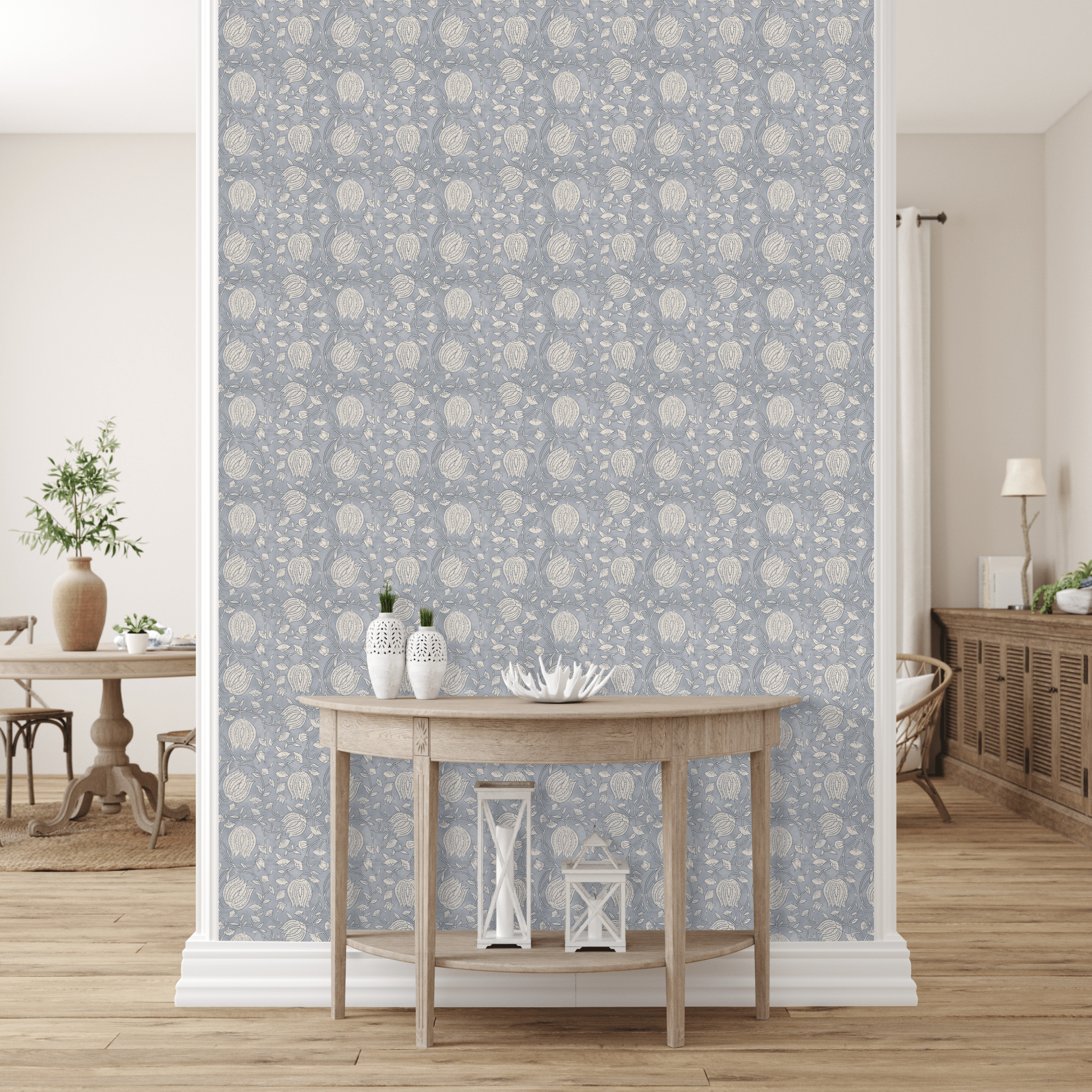 chic room with a wall featuring blue lotus pattern peel and stick removable wallpaper. A wooden console table with decorative lanterns and a coral ornament enhances the space. In the background, a plant and a sideboard blend seamlessly