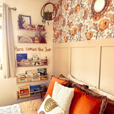 Bohemian styled bedroom featuring floral wallpaper