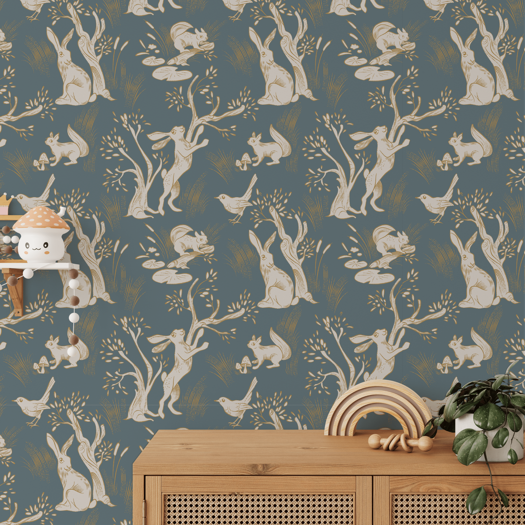 A whimsical children's room featuring a wallpaper with a repetitive pattern of white rabbits in various poses amongst trees and foliage on a blue background.