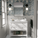 A bathroom with the walls covered in a woodland-themed wallpaper showcasing white rabbits, trees, and birds on a blue background.