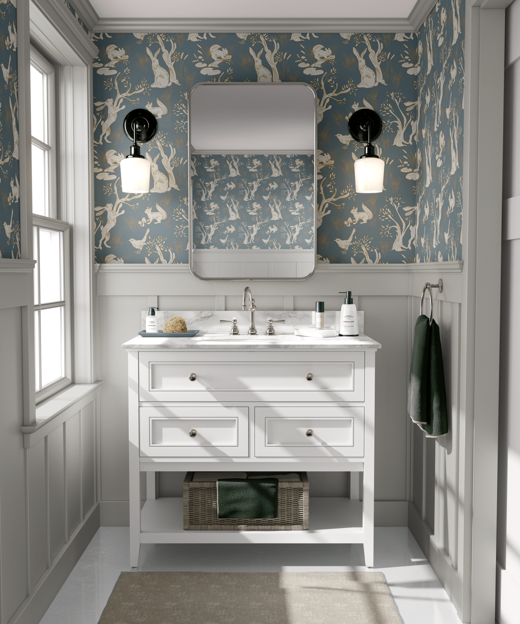 A bathroom with the walls covered in a woodland-themed wallpaper showcasing white rabbits, trees, and birds on a blue background. 