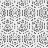 Close-up of a peel and stick wallpaper sample showing a black and white geometric hexagon pattern with intricate details, offering a modern and bold design for wall decor.