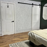 Beautiful master bedroom with earthy tones and minimal floral removable wallpaper