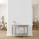 A sophisticated room with the same high-quality hydrangea wallpaper. It's complemented by a rustic wooden console table and minimalist decor.