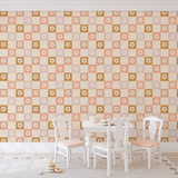 Children's playroom with pastel pink picnic-themed wallpaper, white table and chairs set, and playful decor