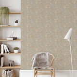 Rustic floral peel and stick wallpaper adding a touch of country charm to a minimalist study with floating shelves.