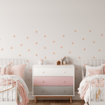 Shared girls room with pink decor and small peel and stick daisy stickers