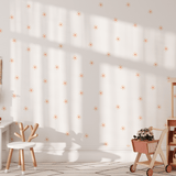 Child's play space with peel and stick small daisy wall stickers on the wall