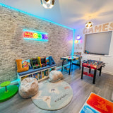 Kids arcade room with peel and stick stone brick wallpaper