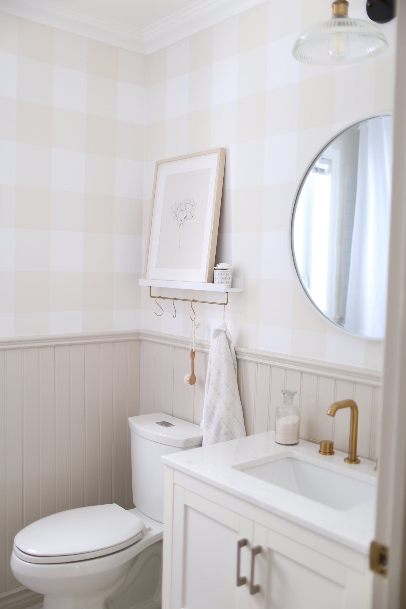 bathroom wallpaper with tan check above wainscotting