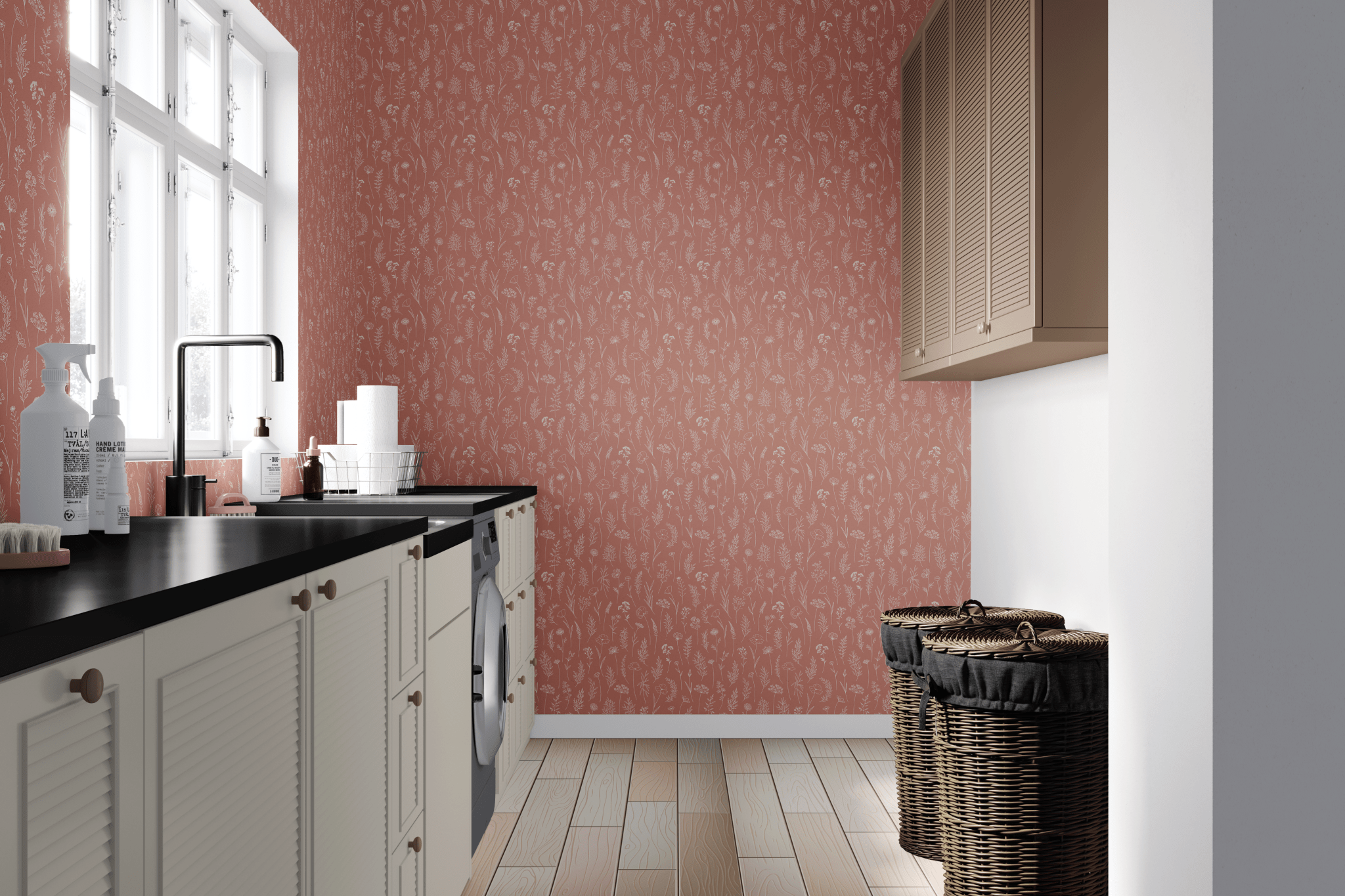 A modern laundry room with a bold terracotta dainty floral wallpaper, contrasting with white cabinets, black countertops, and wicker laundry baskets.