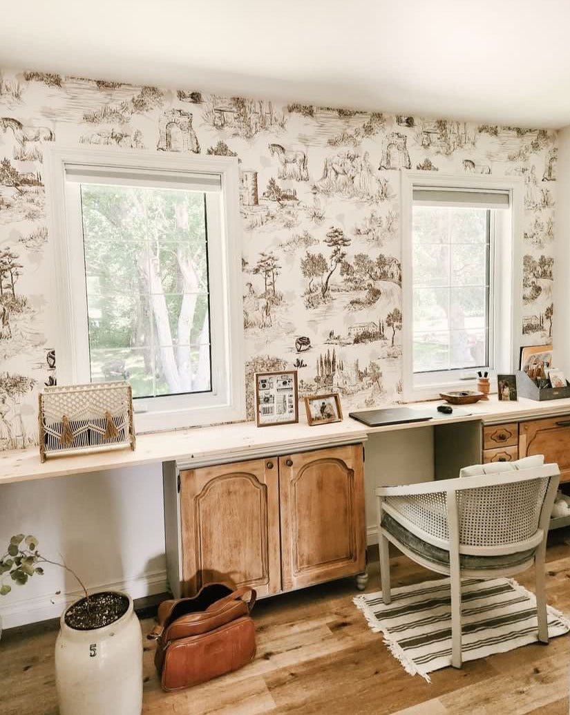 Natural coloured office featuring toile de jouy wallpaper