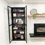 tulip wallpaper peel and stick in a living room in a black display case