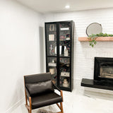 tulip wallpaper peel and stick in a living room in a black display case in a living room next to a brick fireplace