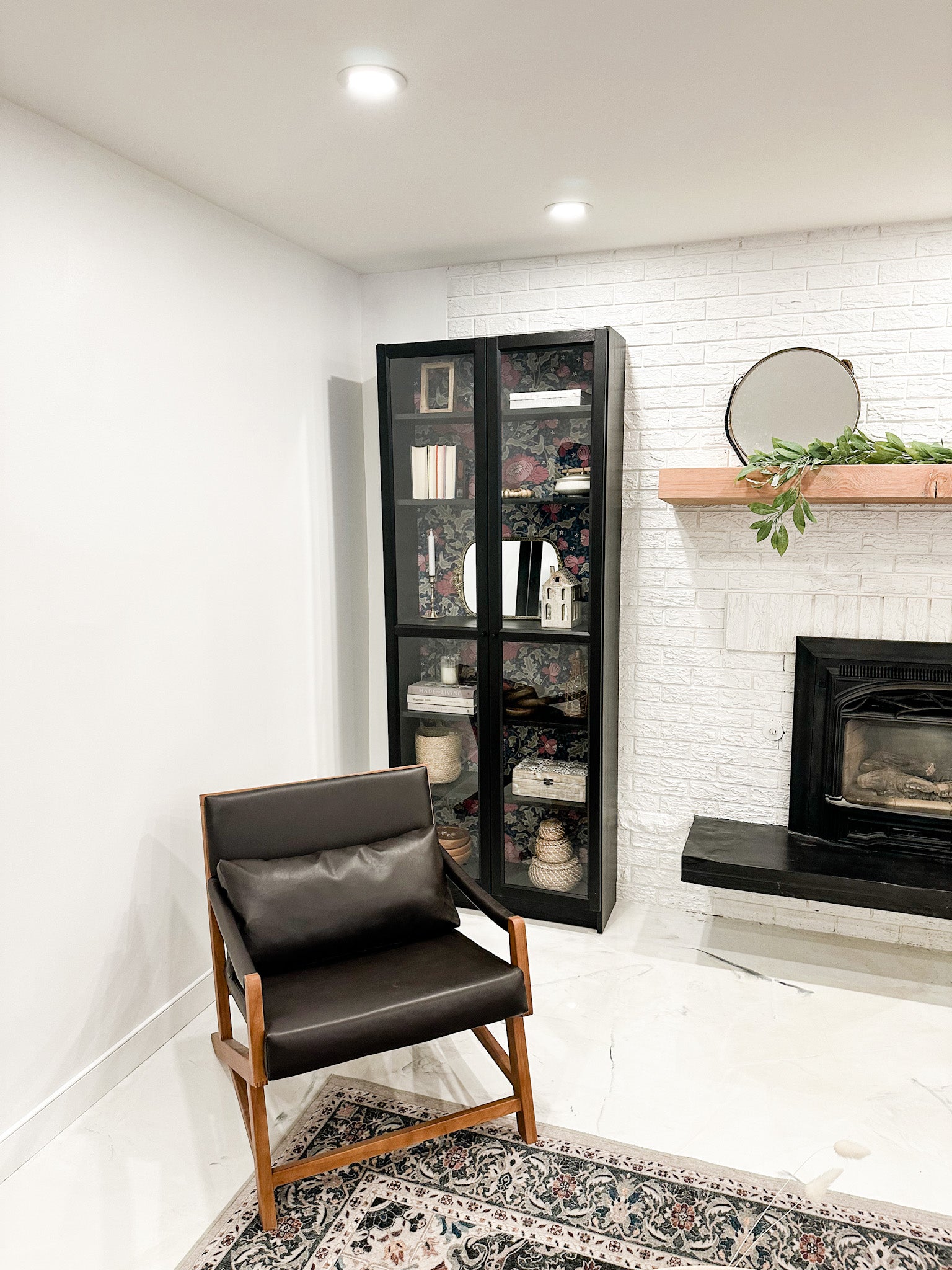 tulip wallpaper peel and stick in a living room in a black display case in a living room next to a brick fireplace