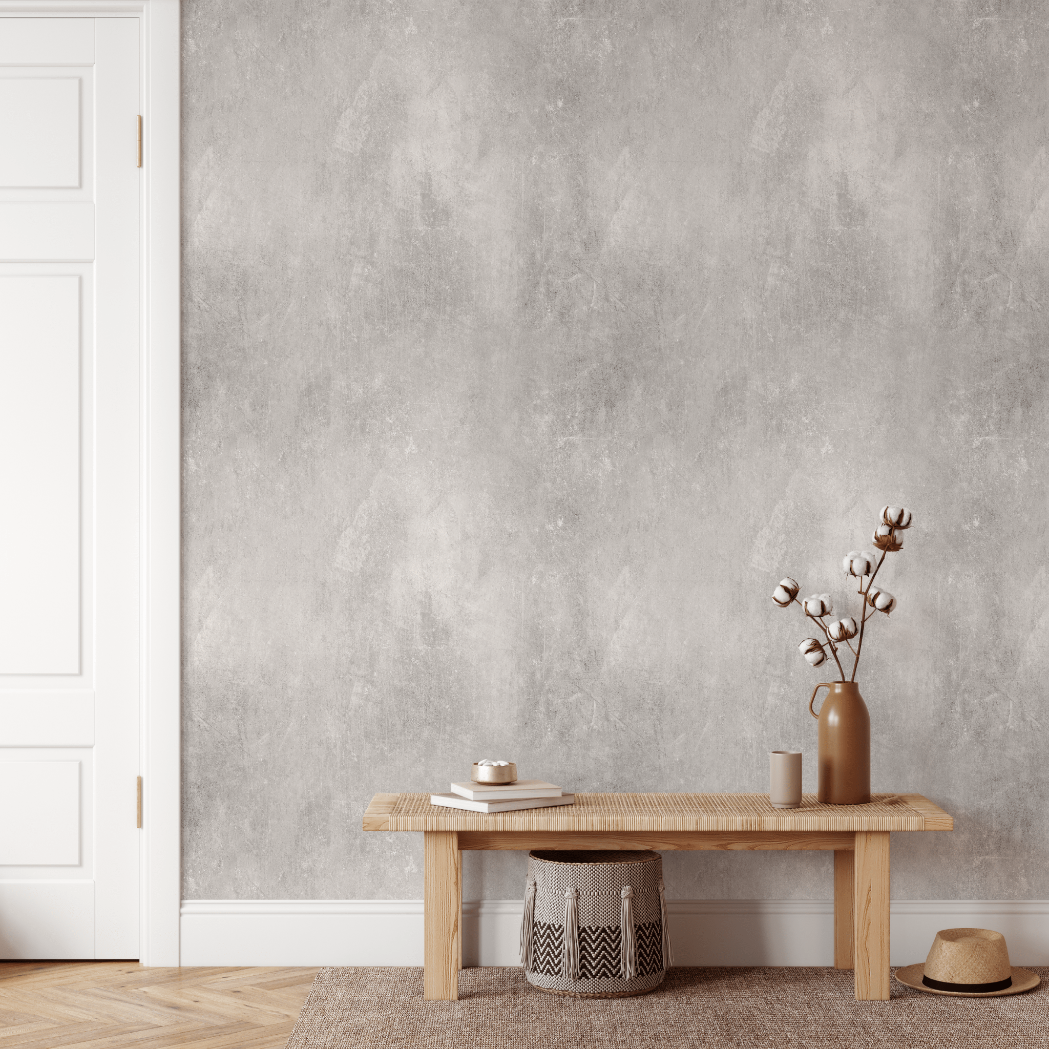 Contemporary minimalist living space with Venetian plaster wall texture, featuring a wooden coffee table, chic decor items, and a cozy woven basket in a serene room ambiance. Cement concrete wallpaper