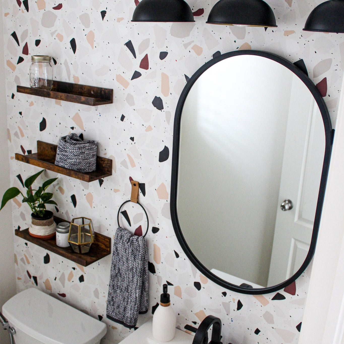 Terrazzo bathroom wallpaper with black accents