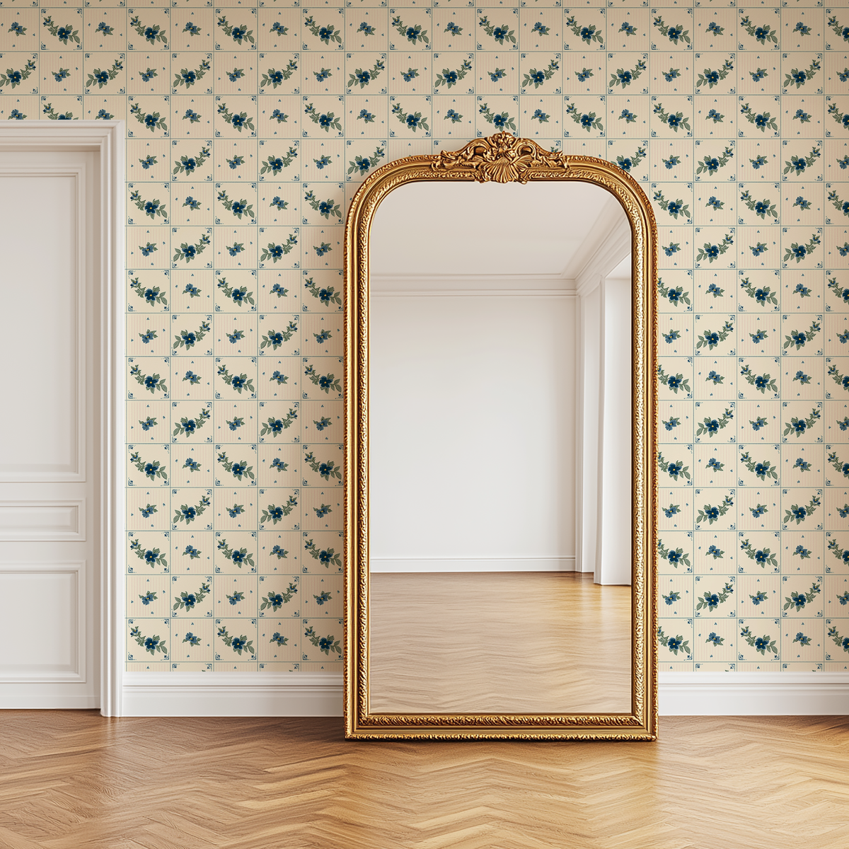 Azulejo blue and cream floral tile wallpaper styled with ornate gold floor mirror and warm wood flooring