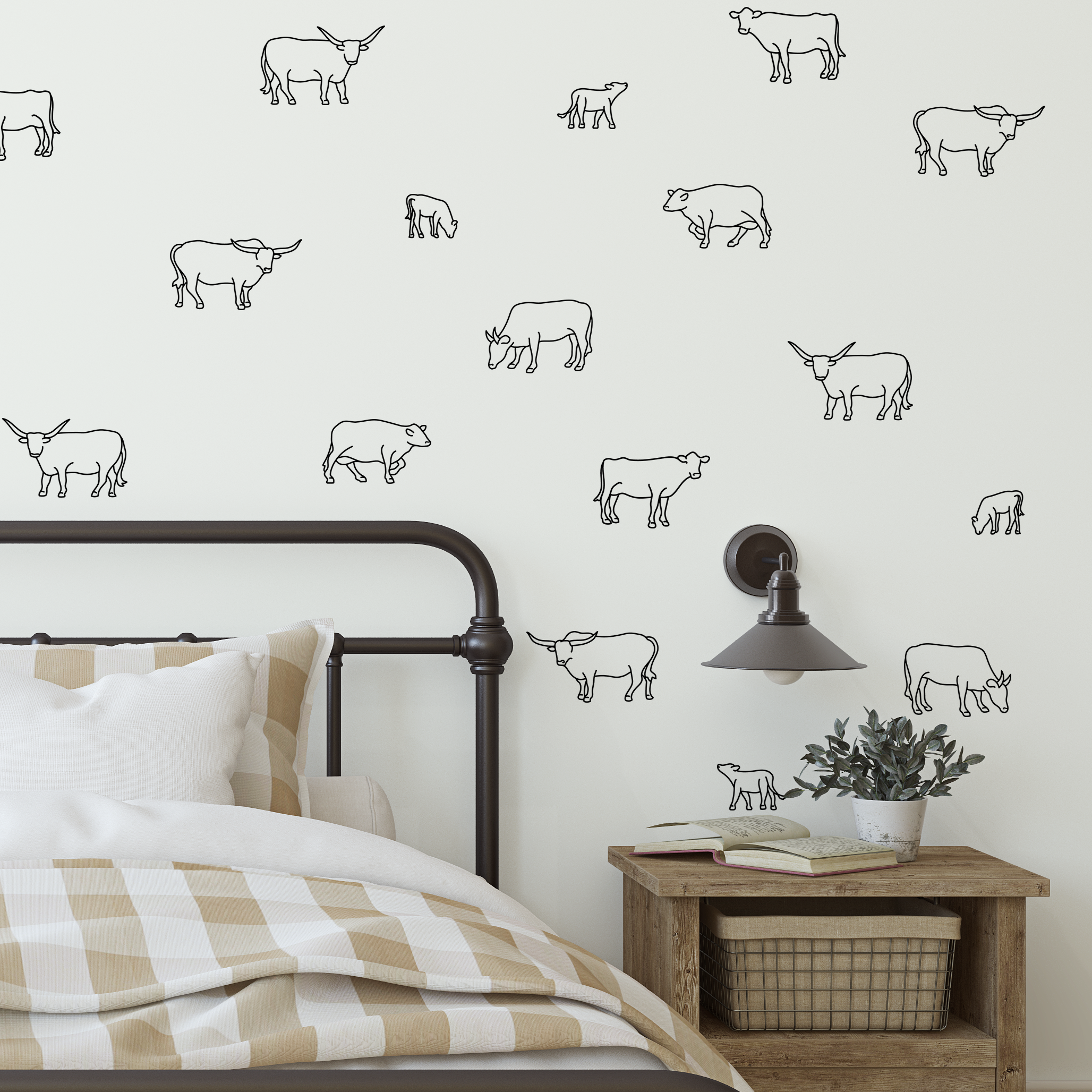Black outline cow decals on white wall in rustic bedroom with checkered bedding