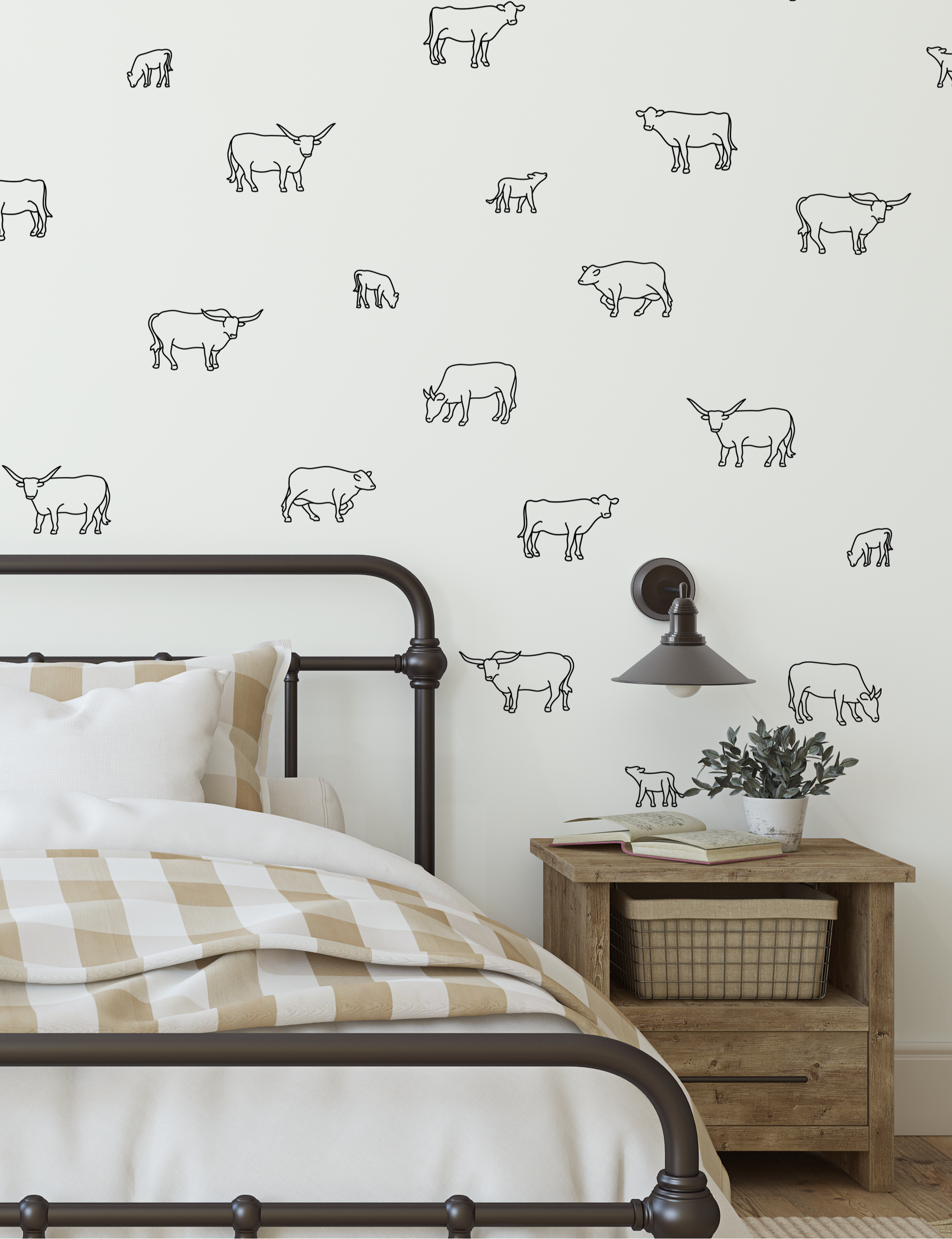 Black outline cow decals on white wall in rustic bedroom with checkered bedding