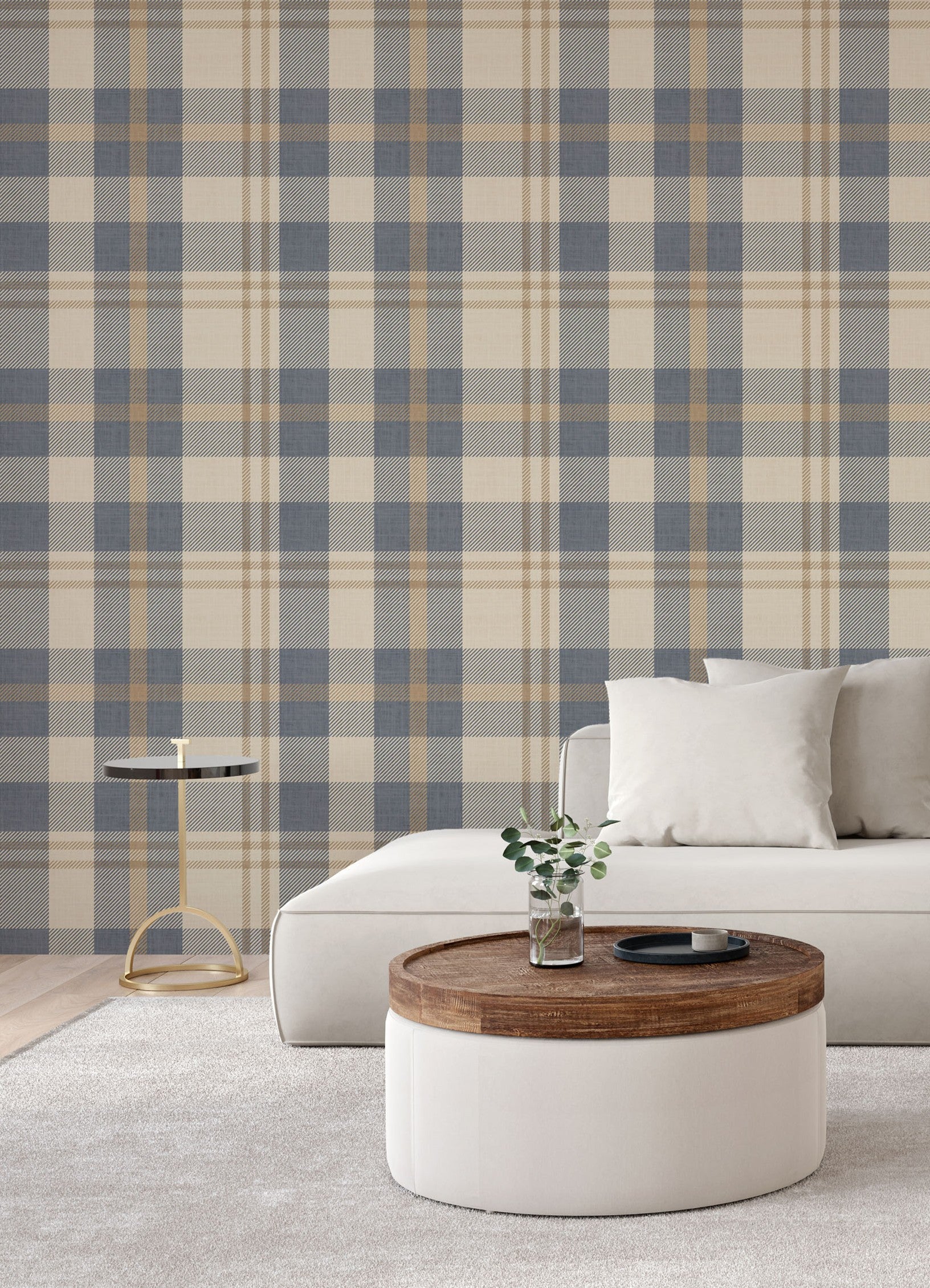 Living room with blue and cream plaid wallpaper behind a white sofa, cozy modern accent wall design.