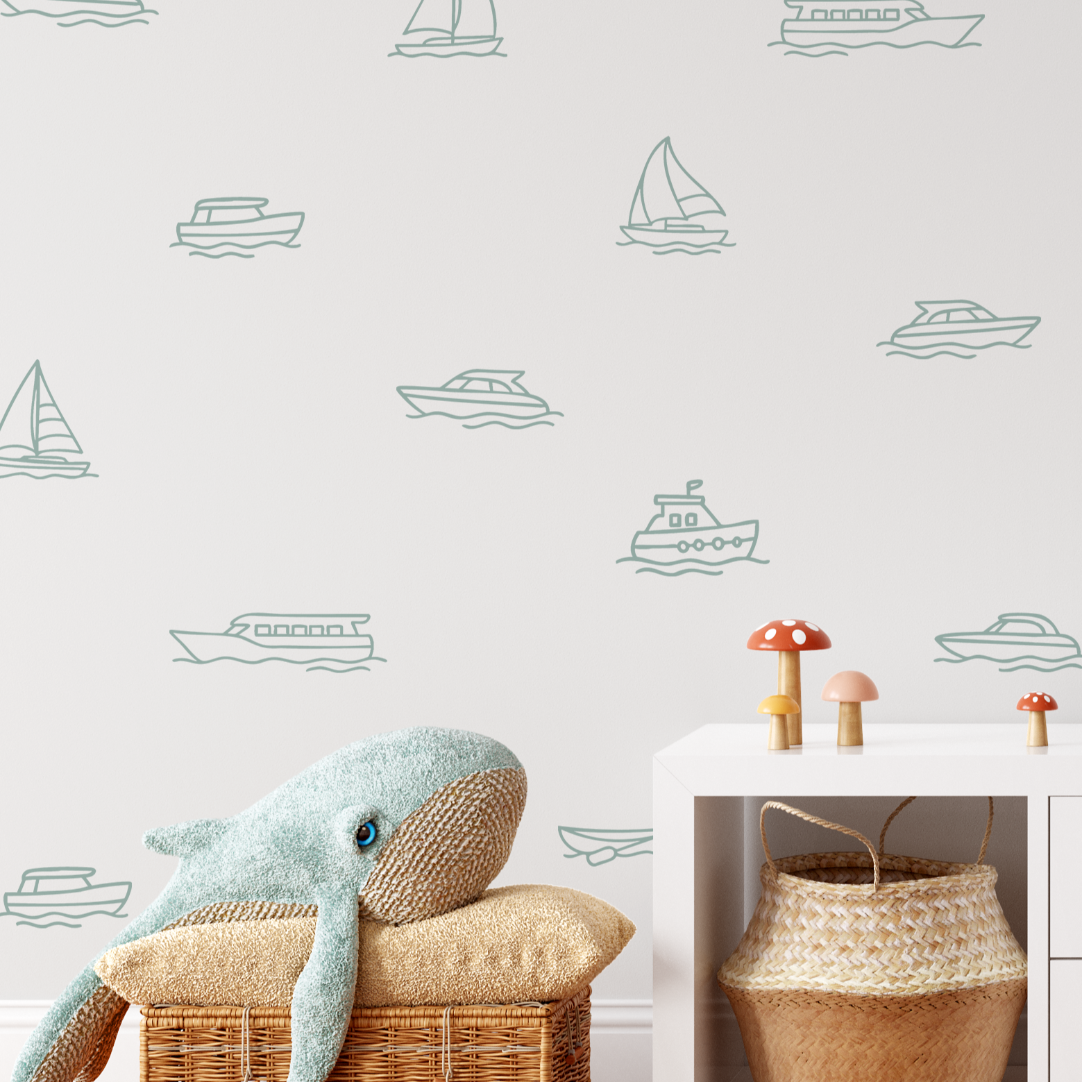 Boat decals on white wall with whale plush and wicker baskets, nautical outline wall stickers for kids’ room or playroom.
