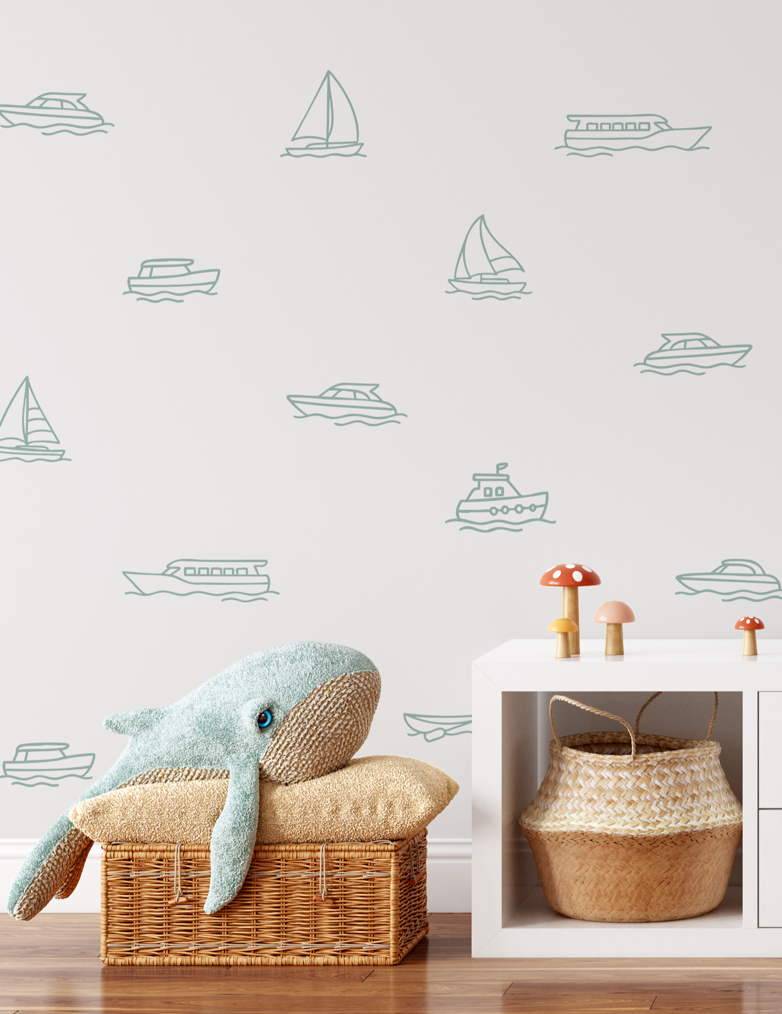Boat decals on white wall with whale plush and wicker baskets, nautical outline wall stickers for kids’ room or playroom.