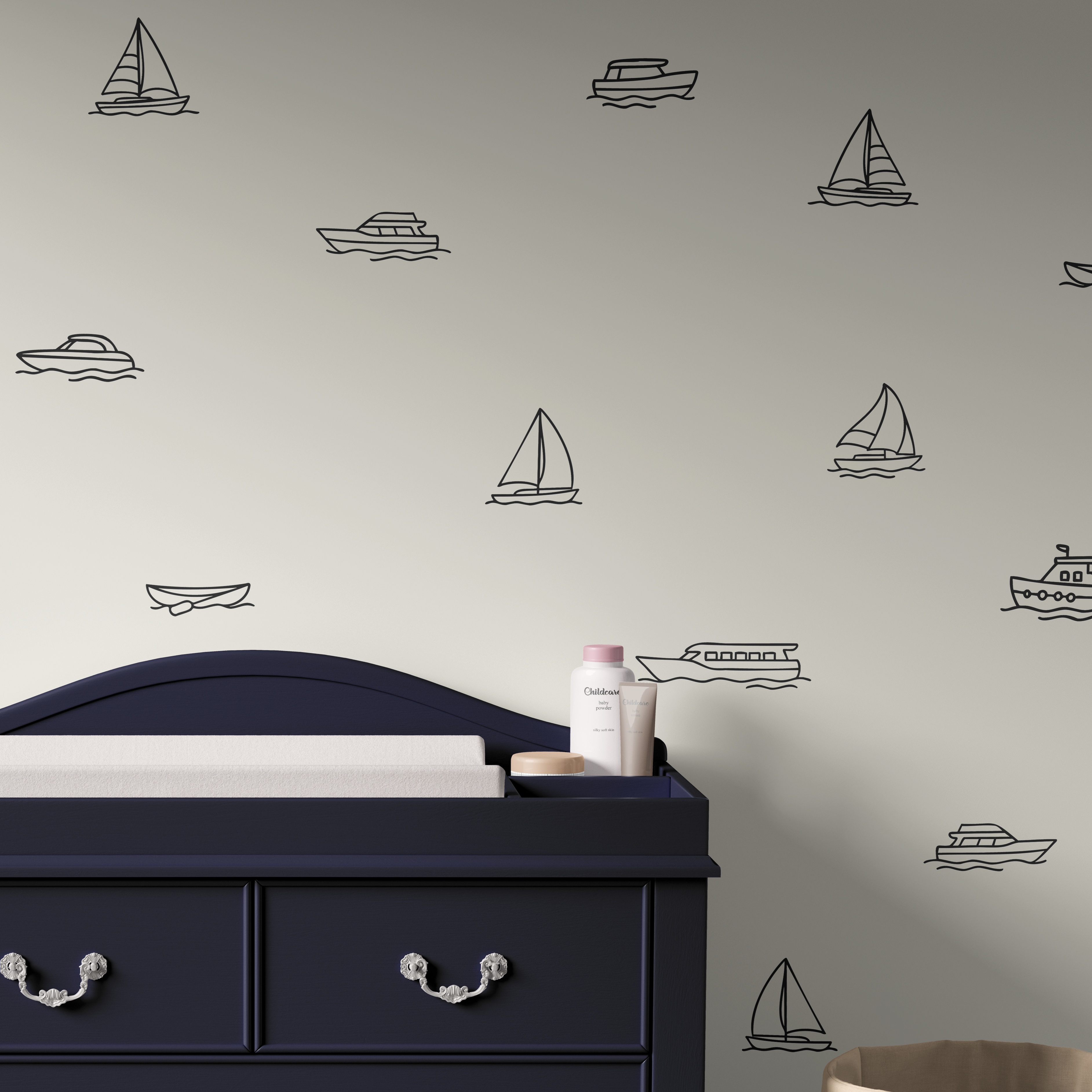 Boat decals on soft beige wall with navy dresser, sailboat and yacht wall stickers for nautical nursery decor.
