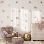 Dusty rose butterfly and flower wall decals in a nursery room