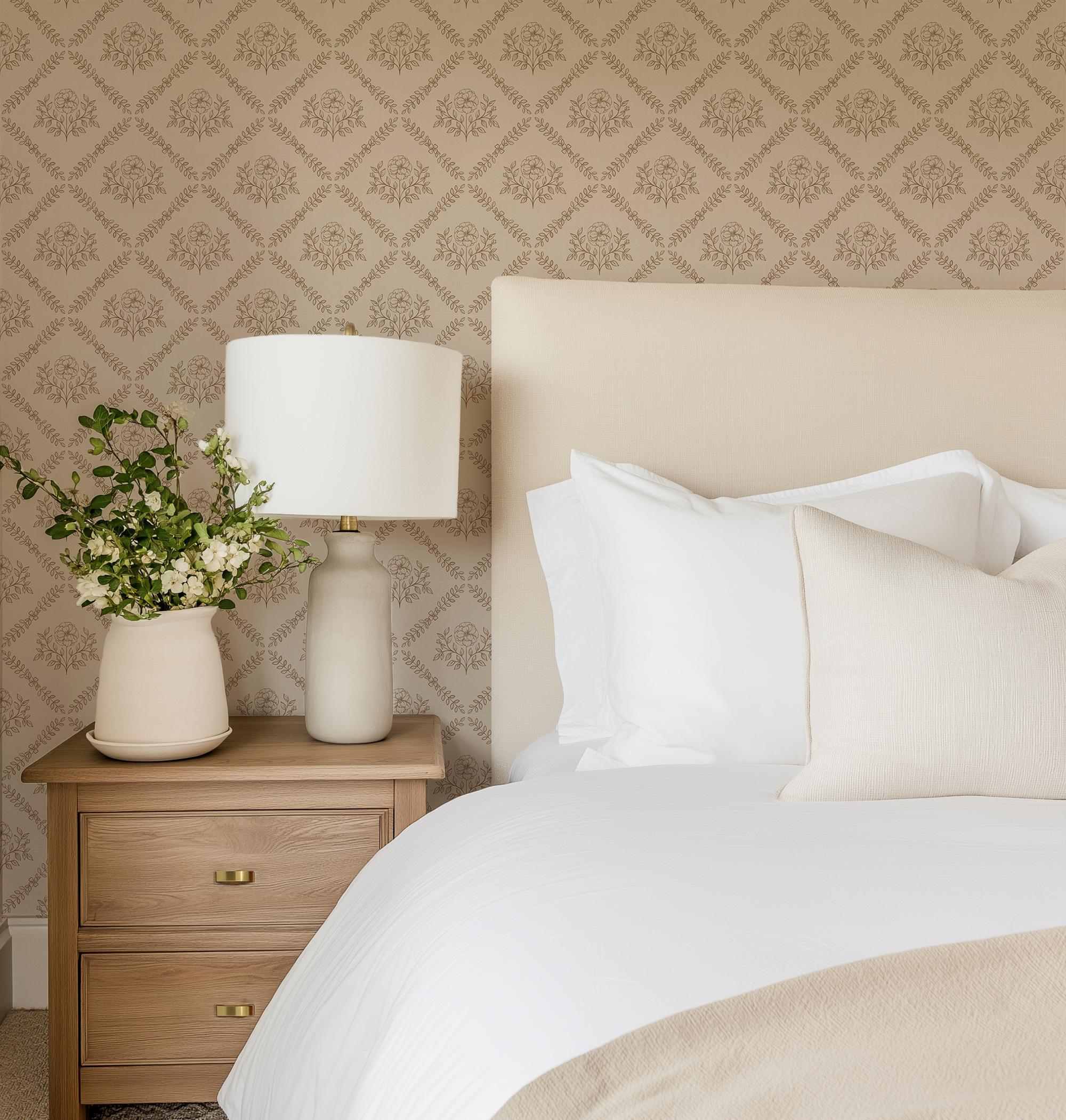 Brown Floral Medallion Wallpaper in a cozy bedroom with upholstered headboard, wood nightstand, and warm neutral bedding.
