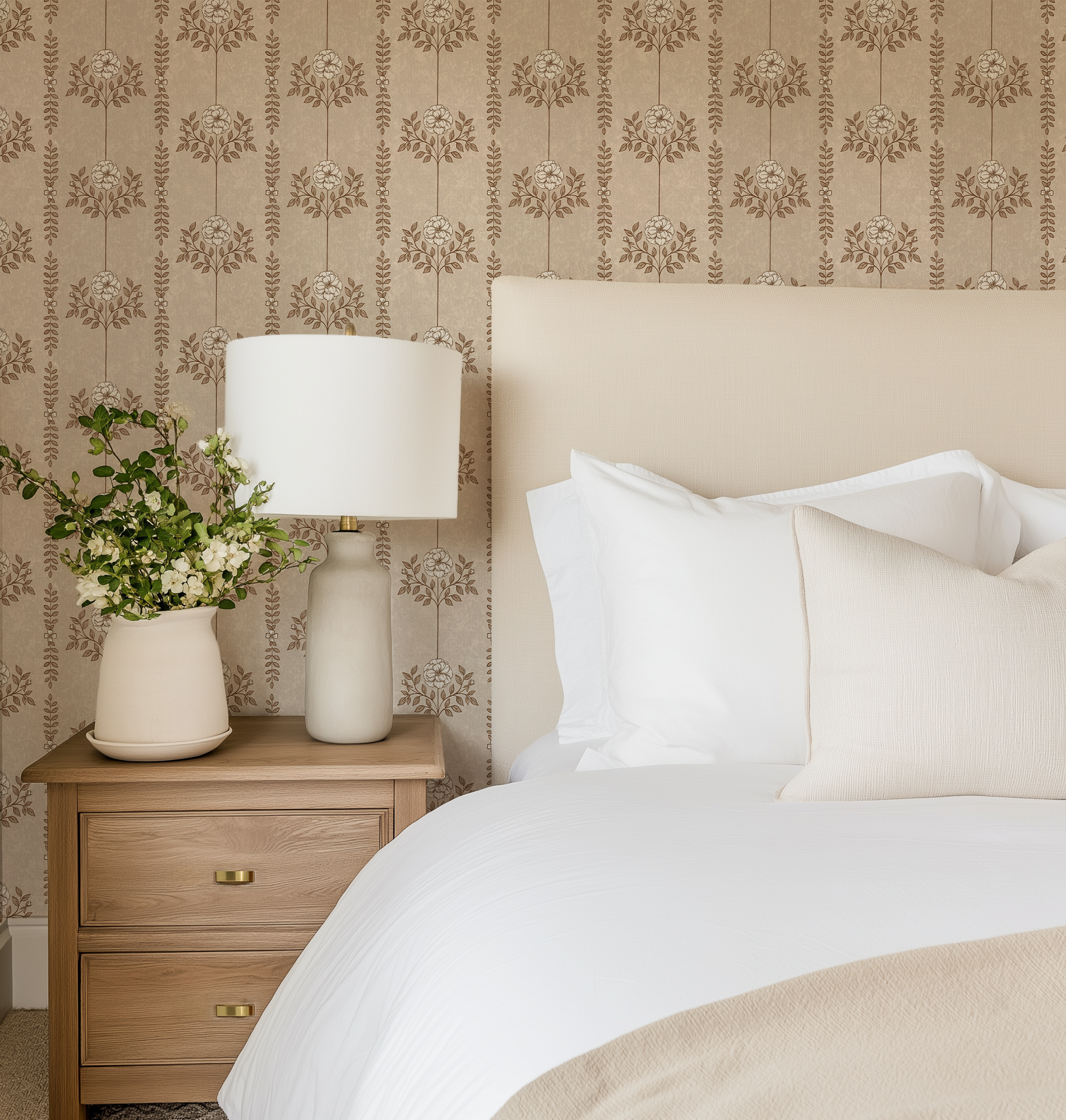 Brown Hanging Floral Wallpaper in a cozy bedroom with upholstered headboard, wood nightstand, and warm neutral bedding.