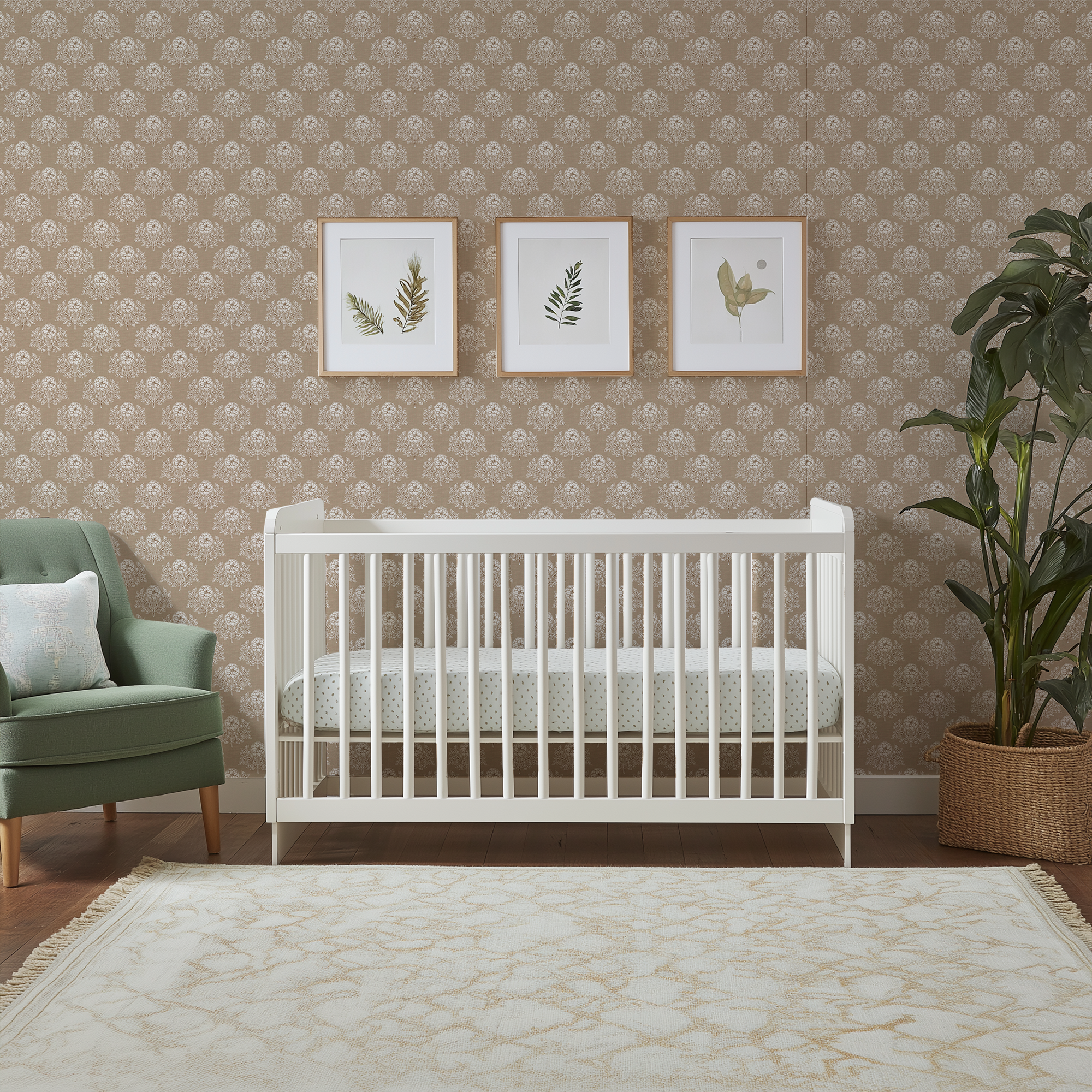 Brown Prairie Floral Wallpaper in a neutral nursery with a white crib, botanical artwork, and soft vintage floral walls.