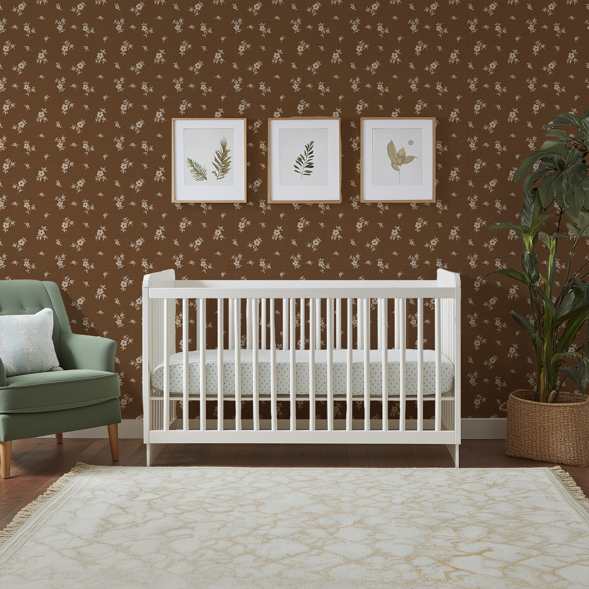 Brown Scattered Floral Wallpaper in a nursery featuring a white crib, sage green chair, and warm vintage-inspired floral wallpaper.
