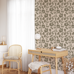 Neutral brush stroke floral wallpaper with organic botanical pattern in a light-filled home office