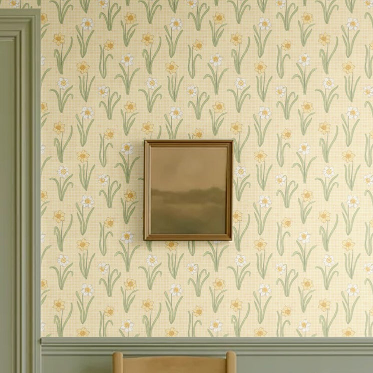 Vintage yellow floral wallpaper with green paneling and a framed landscape painting
