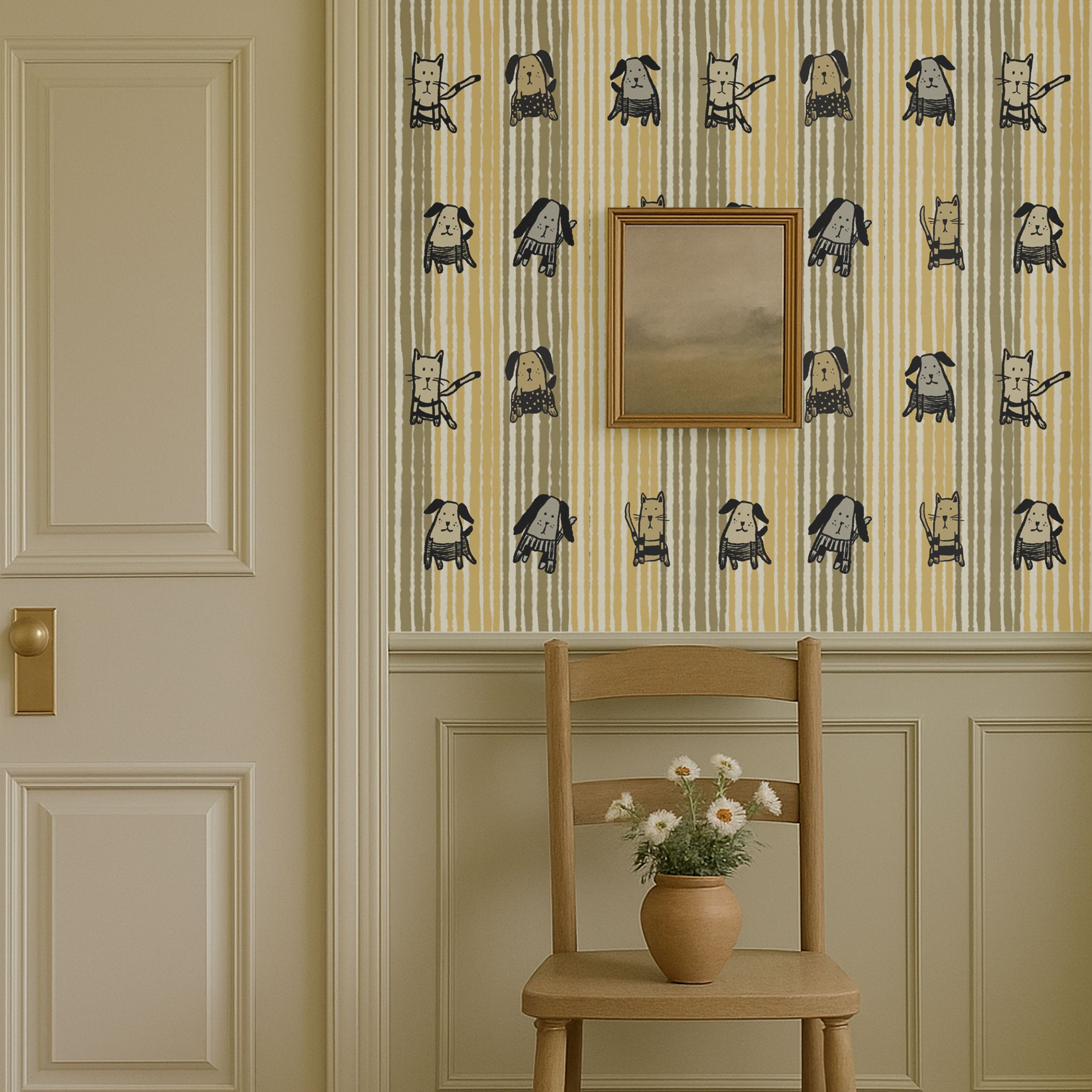 Whimsical cats and dogs wallpaper on striped background in beige and mustard tones, styled in a cozy room with chair and flowers.