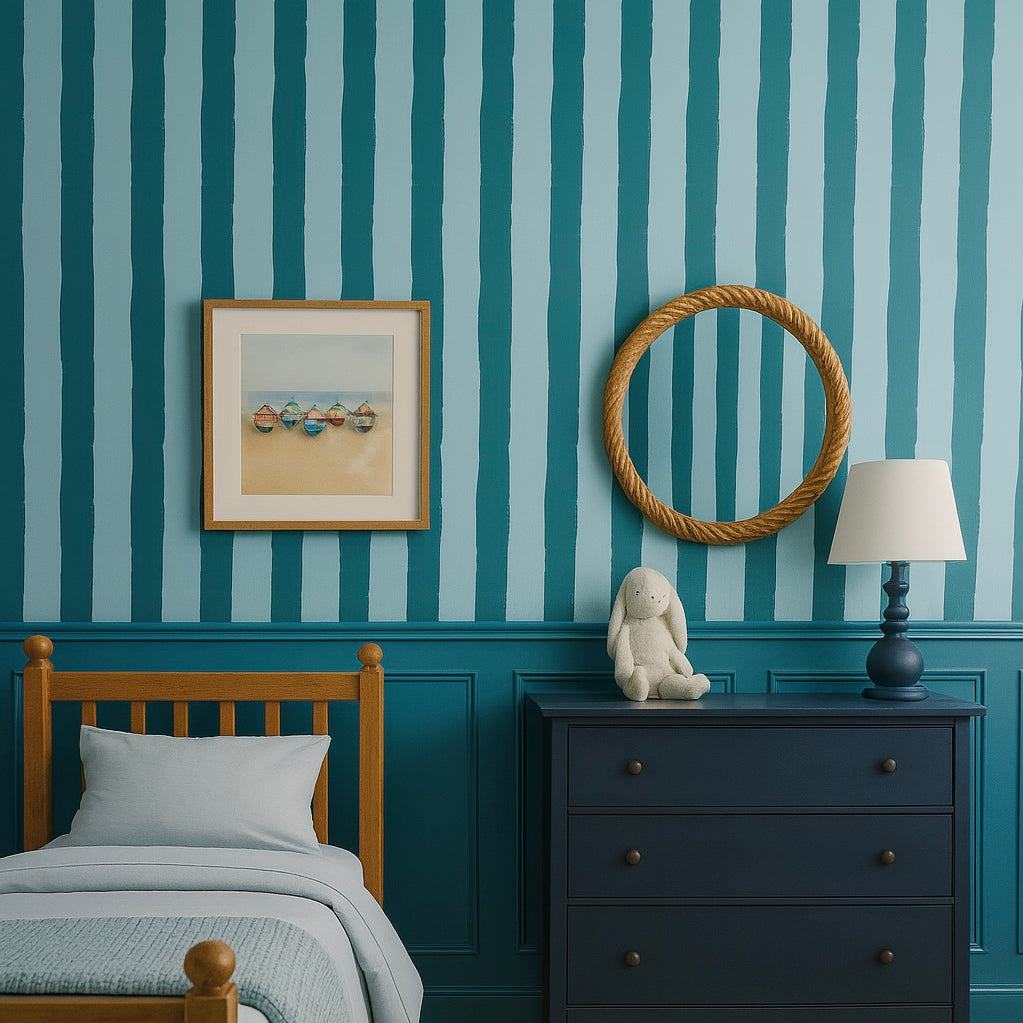 Kids bedroom with bold blue and light blue vertical stripe wallpaper and nautical decor