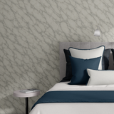 Close-up Marble Wallpaper in Bedroom – detail view of faux marble wall mural behind bed with luxury pillows