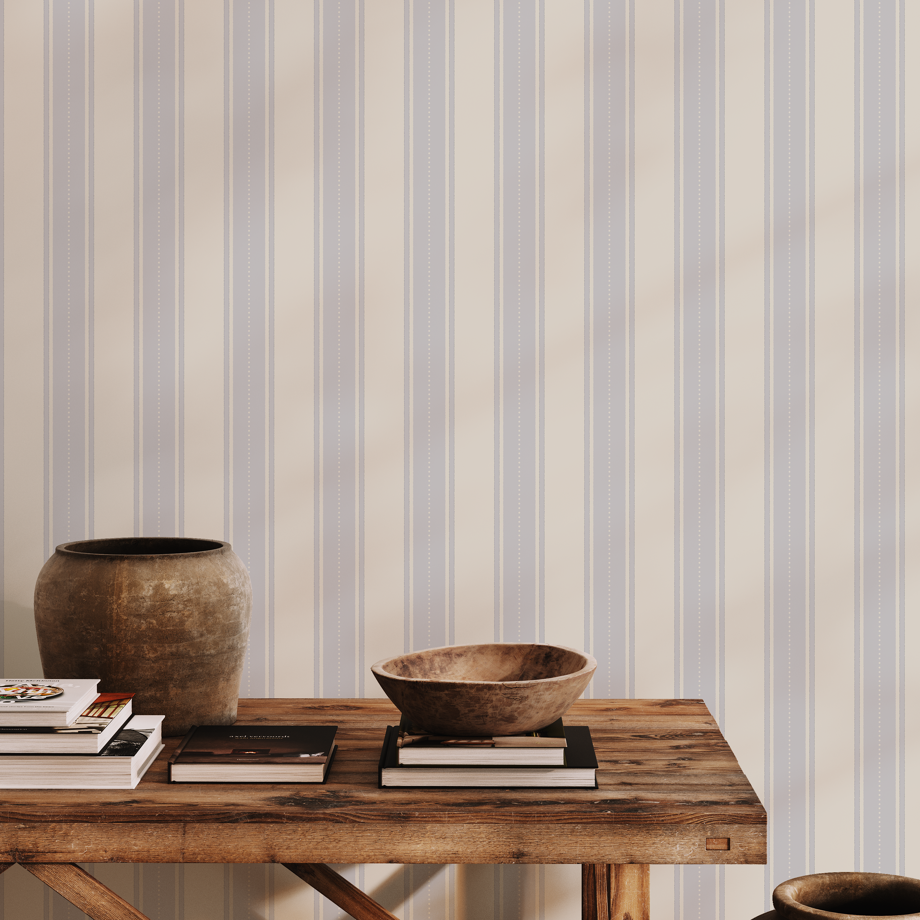 Vintage-inspired blue and cream striped wallpaper styled with rustic wood console table, ceramic vases, and natural decor for a timeless coastal look