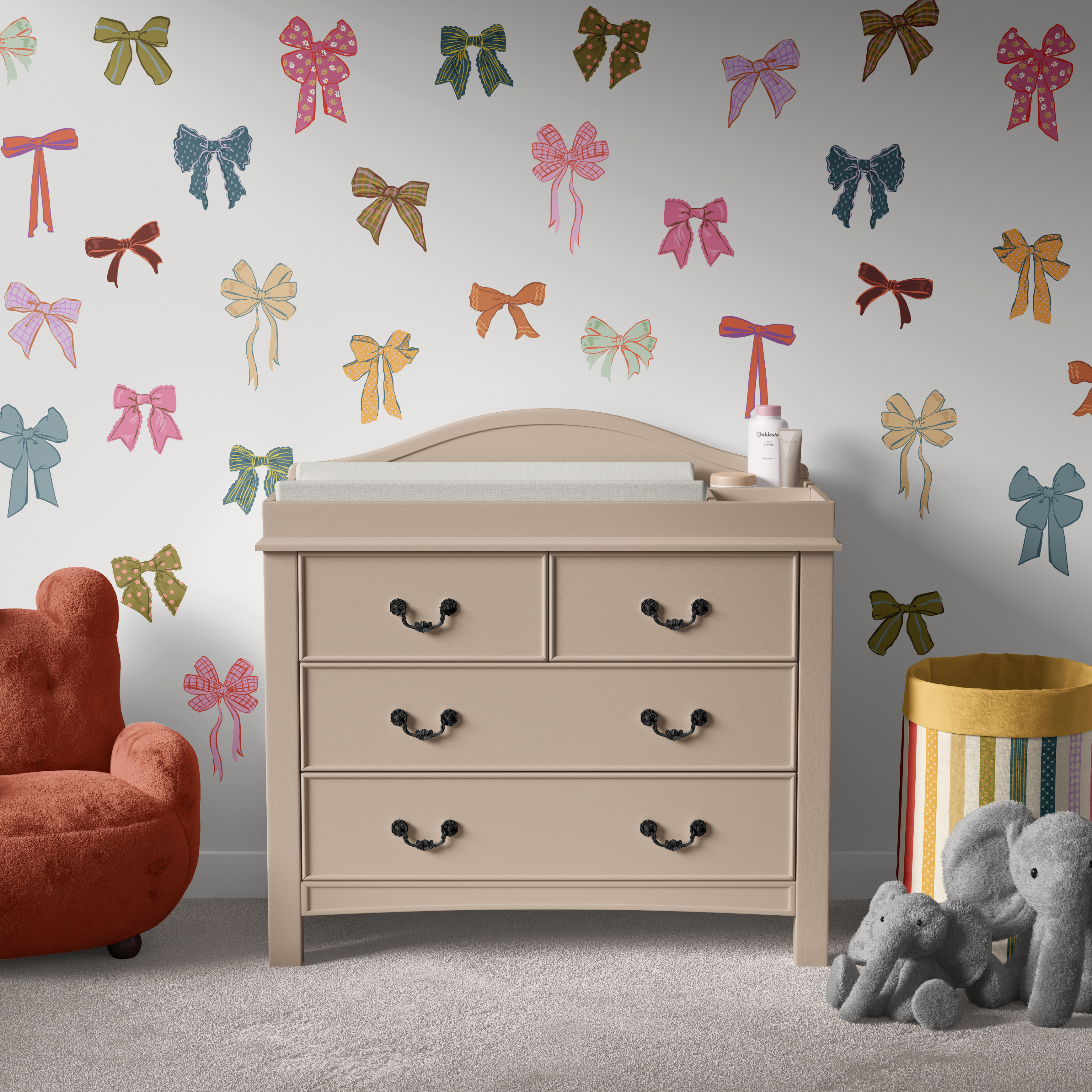 Colorful bow wall decals styled above nursery dresser, multicolor ribbon wall stickers in baby girl room decor