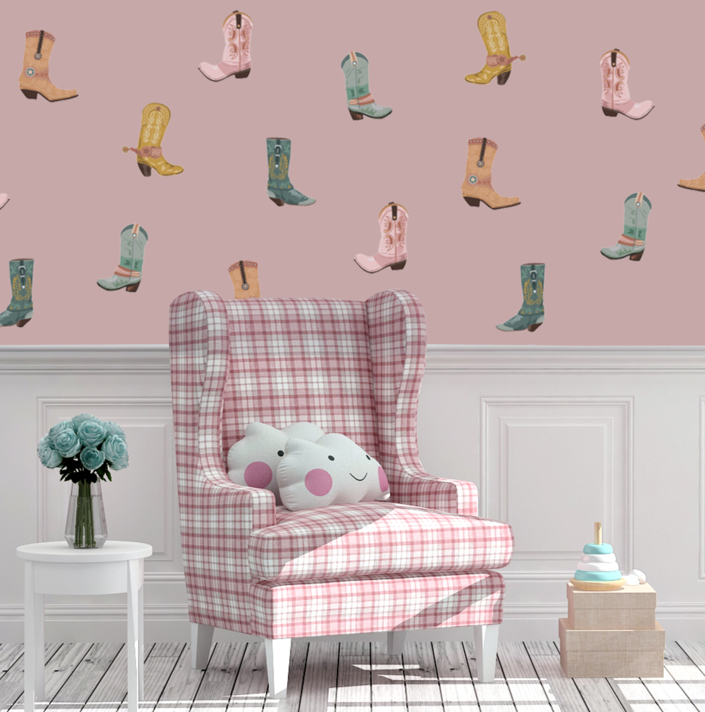 Pink cowgirl boot wall decals in a girls’ room with plaid chair and pastel decor.