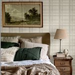 Bedroom with Cream Tartan Wallpaper and rustic wood furnishings.