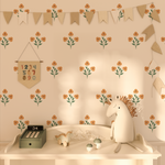 Sweet Spring flower wall decals in soft orange and green arranged on a nursery wall 